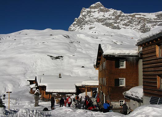 European Swiss backcountry skiing. Sulzfluh Hut with the journalists milling around after various ski tours.