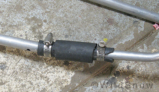 Pulk hose rod trace attachment for skiing. Pulk hose rod trace attachment for skiing.