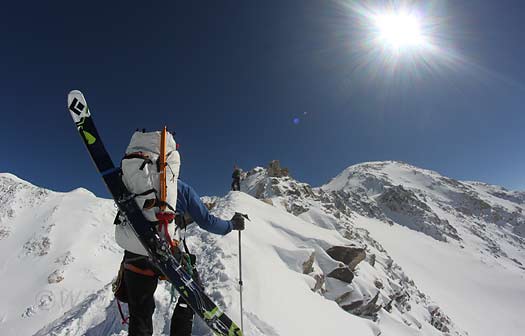 005-6-18-ridge-skis-cilo-IMG_730 Looking ahead at a hard day to come. We didn't skimp on gear, as the size of the pack indicates. An emergency stove and sleeping bag were carried by the group, and we brought all our high altititude clothing, some of which we'd carried for two weeks and still had not used.