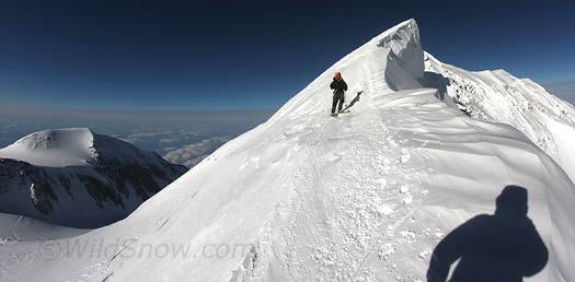 017-sum-ski-IMG_7389 Skiing off the summit requires a bit of scrapping down the ridge ascent route, to line up for the Football Field. If you've got time and want to ski roped up there are other options, but when it's around 15 below zero with wind, and you're not totally acclimated, you might just take the path of least resistance.
