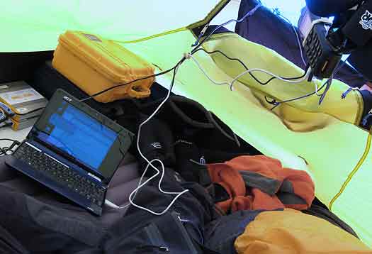 IMG_0602-solar-computer How it looks in real life inside the tent. I brought along an efficient external antenna for the satphone, so I can hang the phone anywhere in the tent and not have to worry about positioning it during calls. The external antenna also gives me more reliable connections, an issue when mountains block the horizon.