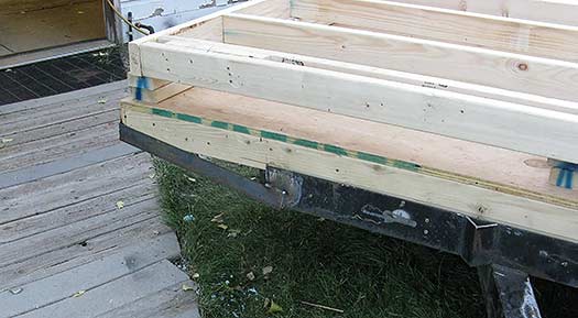 Backcountry skiing hut on a trailer. We built the hut about three feet wider than the trailer, then added some steel to tie it all together. Total width is 9 feet 6 inches. We'll need a wide load permit for moves, but getting those in Colorado is quick and easy.