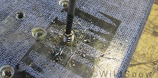 Extracting broken ski binding screw. Extracting broken ski binding screw.