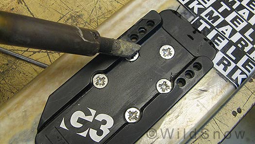 Heating binding screws to break epoxy bond. Heating binding screws to break epoxy bond.