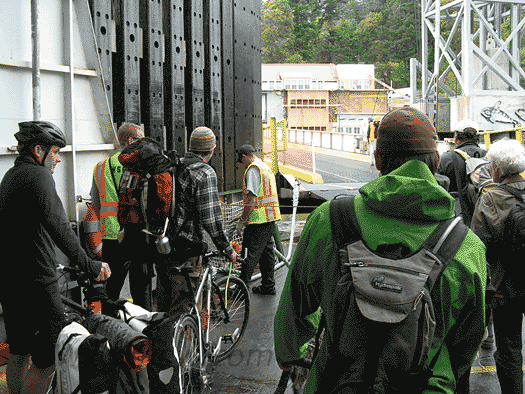We smugly superior foot and bicycle travelers prepare to debark. We smugly superior foot and bicycle travelers prepare to debark.