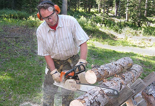 Backcountry skiing wood cutting for cabin. Backcountry skiing wood cutting for cabin.