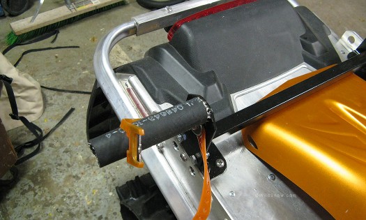 Completed ski support is covered with chunk of hose, strap attached. Completed ski support is covered with chunk of hose, strap attached.