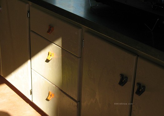 Cabinet sink base, drawer pulls in backcountry skiing RV.