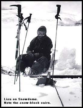 Tea break on Snowdome, during a 5 minute cloud lift. Note the snow block cairn. Tea break on Snowdome, during a 5 minute cloud lift. Note the snow block cairn.
