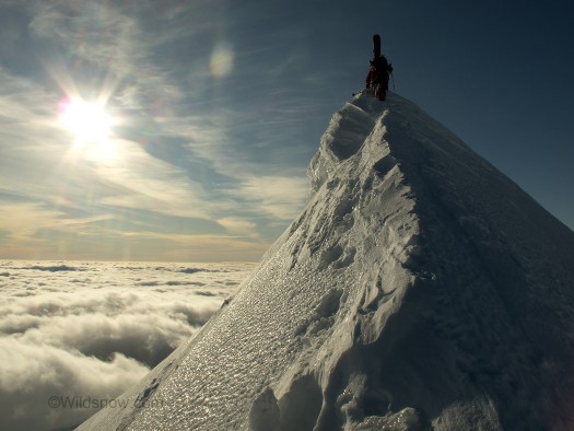 summitridge Ski mountaineering the summit ridge above the clouds