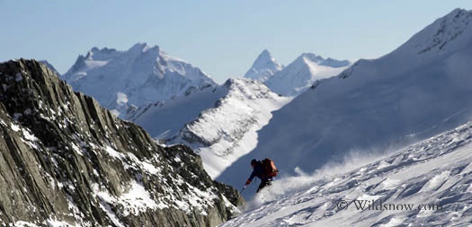 Sharon skiing off the Iconoclast Glacier. In the background are the Nordic peaks and the Nordic Glacier Sharon skiing off the Iconoclast Glacier. In the background are the Nordic peaks and the Nordic Glacier