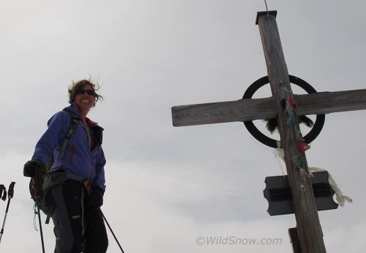WildSnow Girl and the usual classic summit cross. WildSnow Girl and the usual classic summit cross.