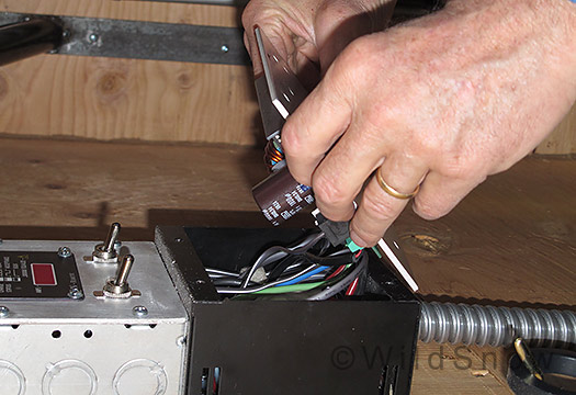 Removing cover from charge controller. Removing cover from charge controller.