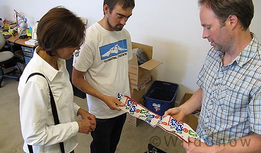 Rob Moore (right) shows Louie and Lisa Dawson the new Alpinist High Traction Skins. Rob Moore (right) shows Louie and Lisa Dawson the new Alpinist High Traction skins.