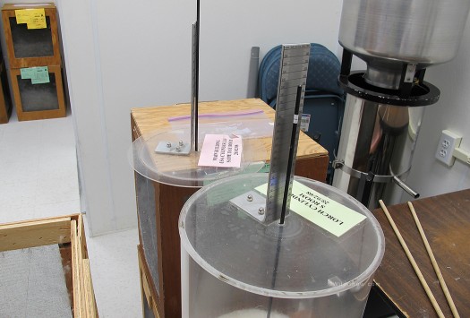 Lorch cylinder with top on and the weight compressing the down, a simple rod indexes on a ruler. Lorch cylinder with top on and the weight compressing the down, a simple rod indexes on a ruler.