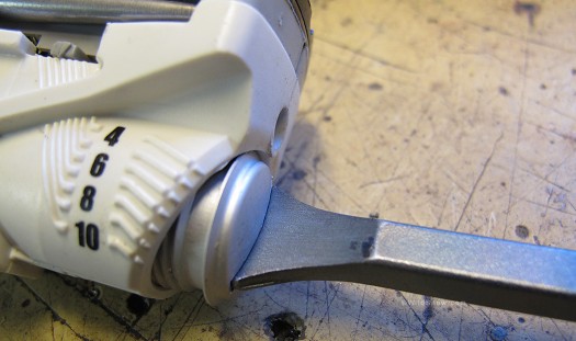The custom tool in use fits the rear spring cap to perfection, thus preventing damage as well as . The custom tool in use fits the rear spring cap to perfection, thus preventing damage as well as .