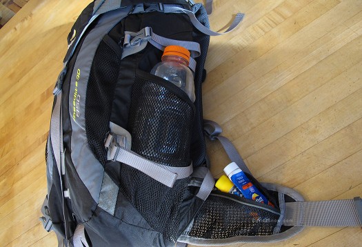 We love open top mesh side pockets. Open mesh catches on tree branches and ski pole tips, but we can live with it. Tighter mesh works better but weighs a few more grams and you can't see what's in there.