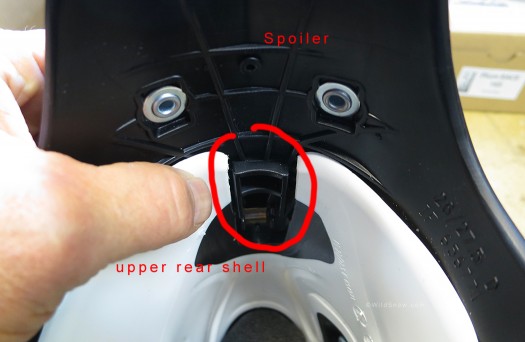 Rear spoiler mates with lower shell cuff using a molded block of plastic. Simple and effective. Rear spoiler mates with lower shell cuff using a molded block of plastic. Simple and effective.