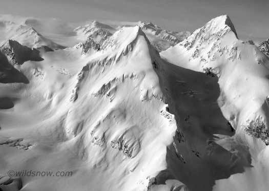 The peak viewed from the plane on the way in. "We have GOT to ski that!" We skied the from the small col just lookers right of the summit, and down the obvious left trending line. The peak viewed from the plane on the way in. "We have GOT to ski that!" We skied the from the small col just lookers right of the summit, and down the obvious left trending line.