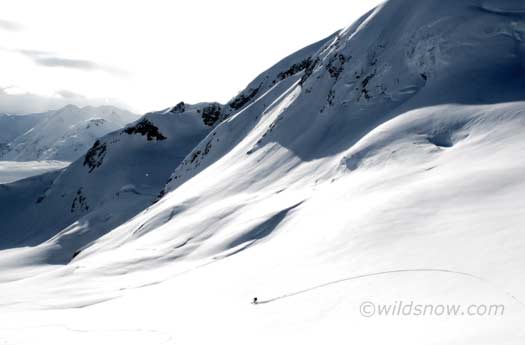 Skiinng early morning powder down a glacier to our objective for the day Skiinng early morning powder down a glacier to our objective for the day