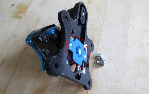 Plum heel unit, spindle base (indicated by red circle) is integrated into the main base plate via attachment with machine screws. Plum heel unit, spindle base (indicated by red circle) is integrated into the main base plate via attachment with machine screws.