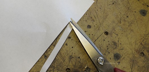 Incredibly sophisticated adjustment tool is carefully cut from paper, about a centimeter wide. Incredibly sophisticated adjustment tool is carefully cut from paper, about a centimeter wide.