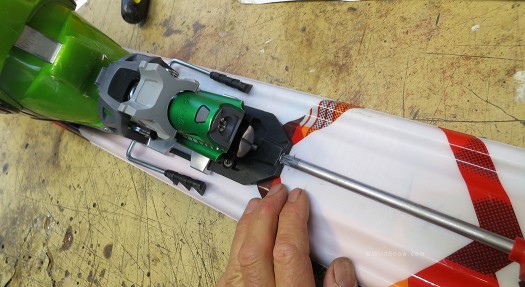 Binding heel moves fore and aft by rotating lower screw as shown. To prevent damage to the screw head, unless you're confident in your power driver, do so by hand with pozi-drive screwdriver. Binding heel moves fore and aft by rotating lower screw as shown. To prevent damage to the screw head, unless you're confident in your power driver, do so by hand with pozi-drive screwdriver.