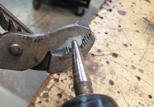 This is the tricky part; making a bushing out of a tiny nylon spacer. This is the tricky part; making a bushing out of a tiny nylon spacer.