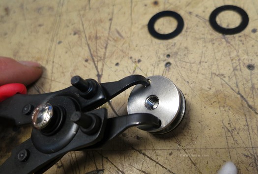 B&D provides a nice little spanner wrench to hold the interior bushing from rotating, or use a modded circlip plier like this. B&D provides a nice little spanner wrench to hold the interior bushing from rotating, or use a modded circlip plier like this.