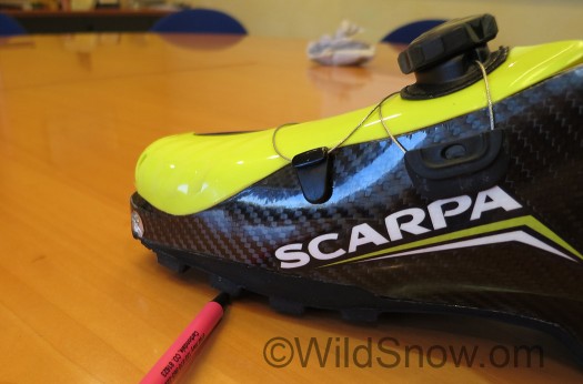 The sole has what I'd call 'side rocker' so it feels a bit more like a shoe when used for walking or running without skis. The sole has what I'd call 'side rocker' so it feels a bit more like a shoe when used for walking or running without skis.