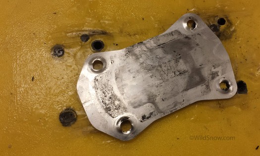Heelplate The binding includes this thin steel plate to be placed under the heelpiece. It allows the unit to move back and forth on a smooth surface. This most likely prevents the wear you might expect.