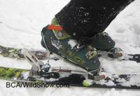 Alpine Trekker inserted in an alpine binding, showing how the boot can lift in a walking stride. Alpine Trekker inserted in an alpine binding, showing how the boot can lift in a walking stride.