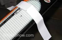To find center using paper, simply wrap a strip of paper around the ski, crease it over the sharp steel base edges, remove and fold in half using the edge marks as reference, then place back on ski and use the crease to locate center. While simple, work carefully (mainly, mark the spot on your ski where you place the paper, as moving it towards the tip or tail will throw things off because of the ski’s varied width.) 