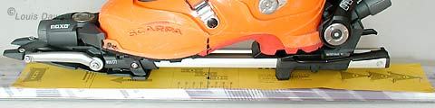 Paper template taped to ski, boot/binding combo set on top to double check placement of template. Paper template taped to ski, boot/binding combo set on top to double check placement of template.