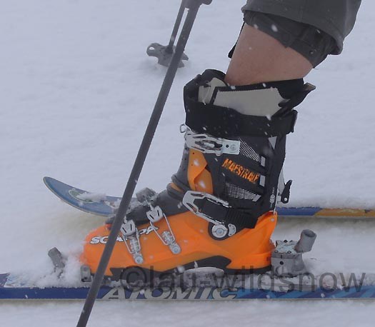 Touring mode cuff movement for backcountry skiing.