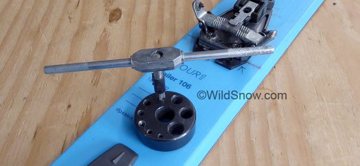 Tap guide is a block of steel or plastic, with holes that hold your tap perpendicular to the work surface. Tap guide is a block of steel or plastic, with holes that hold your tap perpendicular to the work surface.