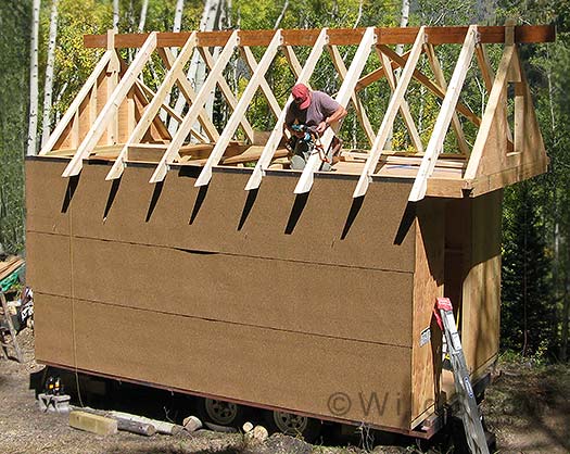 Roof framed on camp trailer.