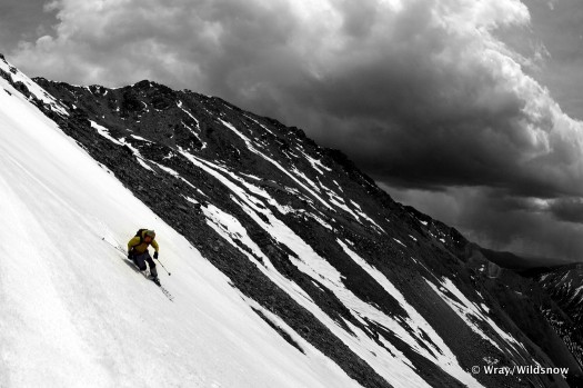 A photo taken in haste to beat a summer storm during a backcountry skiing adventure.
