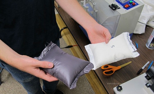 Small pillows are stitched up to test the down or fill proof-ness of fabrics.