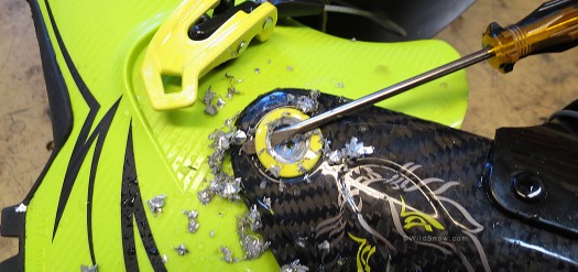 Being ultra careful, you remove just enough material to be able to pop the rivet head off with a screwdriver blade.