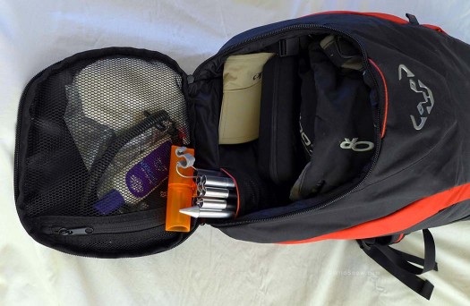  Bucket-shaped top compartment works well for goggles, sun glasses, lightweight gloves, visor, sunscreen, etc. Probe and shovel handle slide nicely into built-in sleeve. Note that none of this is packed very tight, there is still plenty of room for extra layers, another pair of gloves, etc.