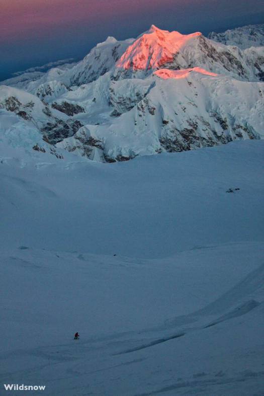 Anton skis as the light fades on Mount Hunter. Of course the light returns in just a couple hours so getting benighted is not too much of a concern. Instead, you're main goal is to keep moving before your physical reserves totally deplete from dealing with the temperatures and maximal effort. Anton skis as the light fades on Mount Hunter. Of course the light returns in just a couple hours so getting benighted is not too much of a concern. Instead, you're main goal is to keep moving before your physical reserves totally deplete from dealing with the temperatures and maximal effort.