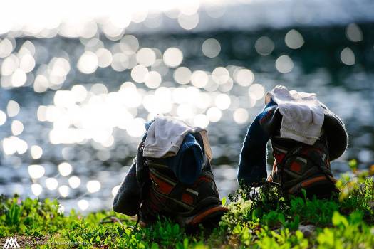 Back at Doris Lake, Zach rests his boots and soaks his feet