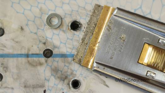IMPORTANT! Screw hole volcanoes must be shaved to perfectly match flat top surface of ski. Epoxy the new screws and tighten carefully so as not to strip the screw holes. IMPORTANT! Screw hole volcanoes must be shaved to perfectly match flat top surface of ski. Epoxy the new screws and tighten carefully so as not to strip the screw holes.
