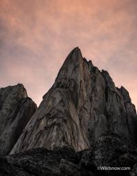 The imposing granite mass of South Howser tower, early morning in the Bugaboos. The imposing granite mass of South Howser tower, early morning in the Bugaboos.