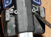 Prying the clips. Lube everything first, and examine with flashlight if you're mystified about how to pry. Prying the clips. Lube everything first, and examine with flashlight if you're mystified about how to pry.