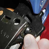 Slip the new plastic boot heel support in and around the new brake. Slip the new plastic boot heel support in and around the new brake.