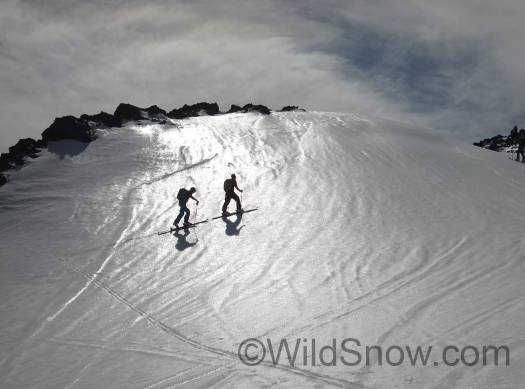 The mountain was covered with a layer of shrink-wrap ice. The mountain was covered with a layer of shrink-wrap ice that softened to various degrees depending on altitude and exposure.