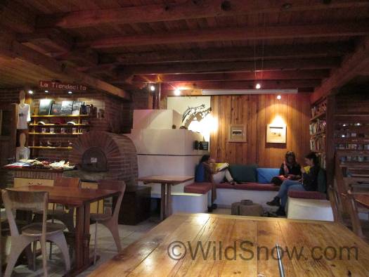 Interior of Suizandina features a tile stove reminiscent of the Alps. Interior of Suizandina features a tile stove reminiscent of the Alps.