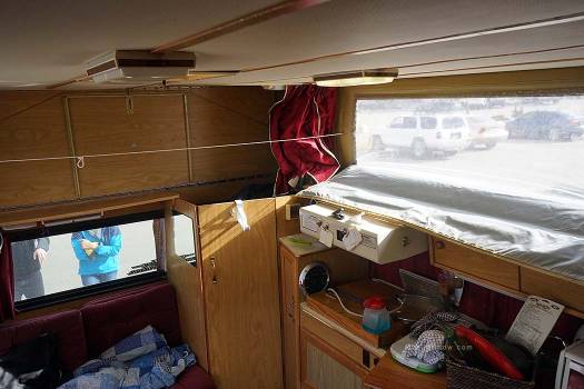 The kitchen area has a vent hood and two burner stove. The kitchen area has a vent hood and two burner stove. After a day of deep powder skiing, Steve will stash his skis there and the any snow drips will go down the shower drain.